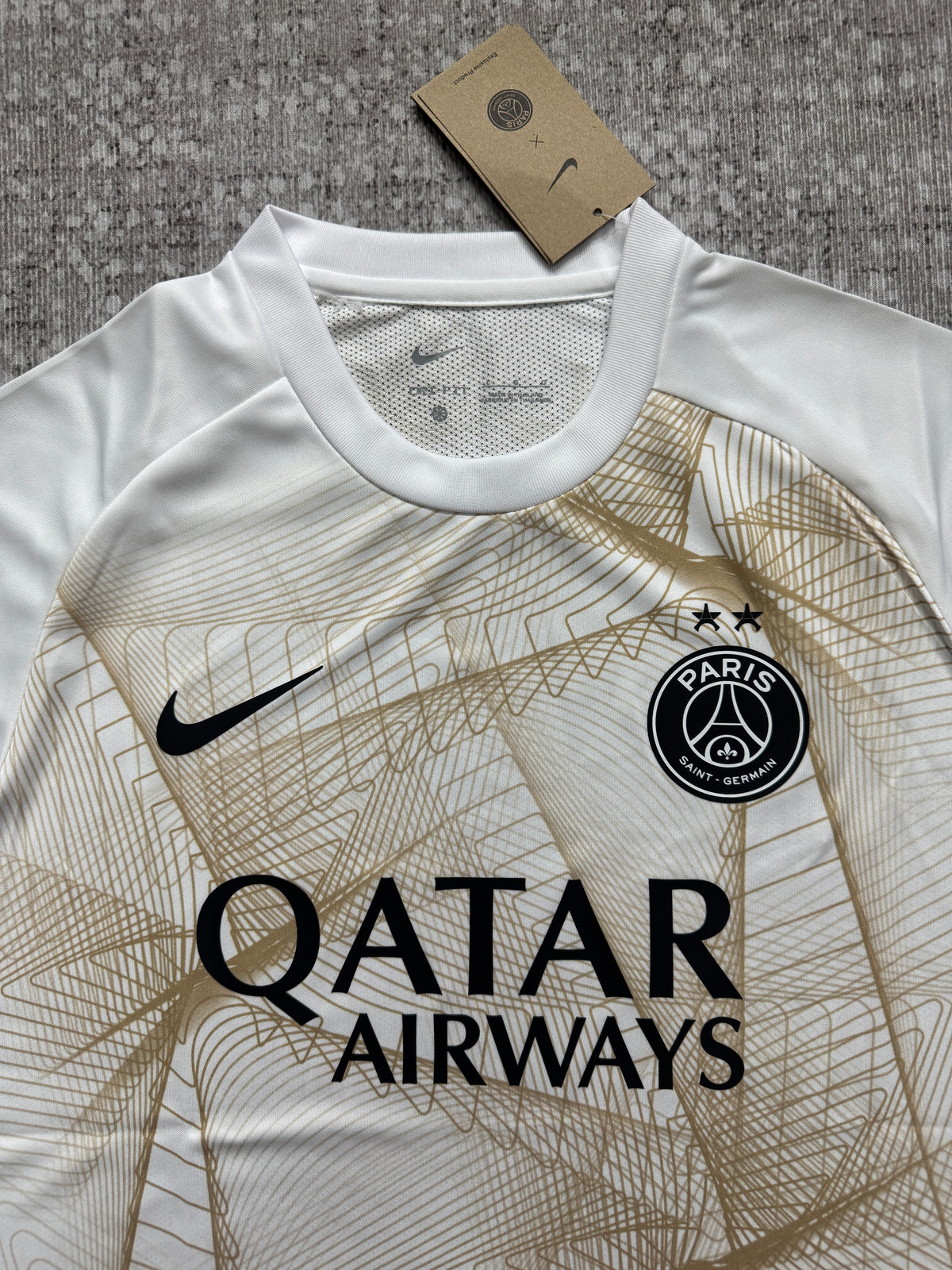 Paris Saint-Germain 2026/27 White and Gold Champions League Pre-Match Shirt — photo 1
